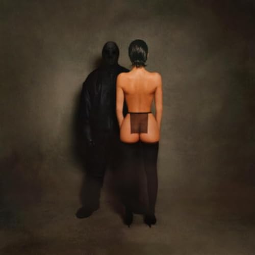 Album cover: two figures seen from behind, dark and muted tones.