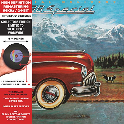 "Album cover featuring a red vintage car and cow in a mountain landscape."