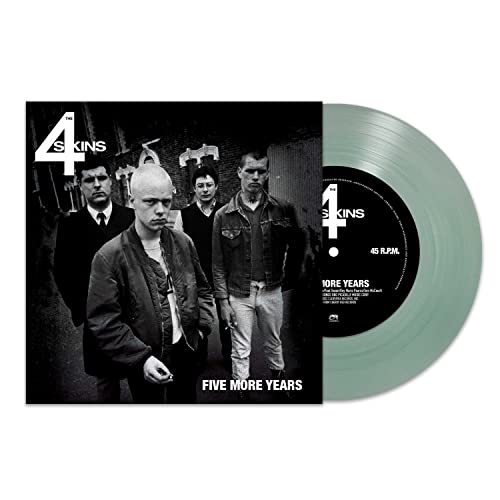 Record sleeve with band photo and a light green vinyl record.