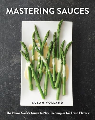 Cookbook cover featuring asparagus with sauce, titled "Mastering Sauces.