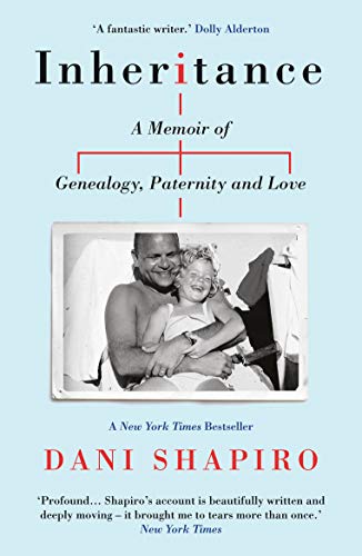 Book cover: “Inheritance” with a black and white photo of a man and child.