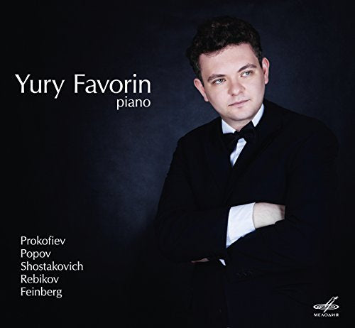 Portrait of pianist Yury Favorin in a suit, album cover.
