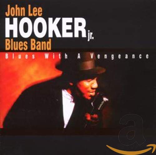 CD cover featuring John Hooker Jr. in a hat with a microphone.