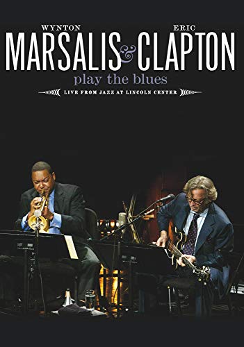 Wynton Marsalis and Eric Clapton performing blues music on stage.