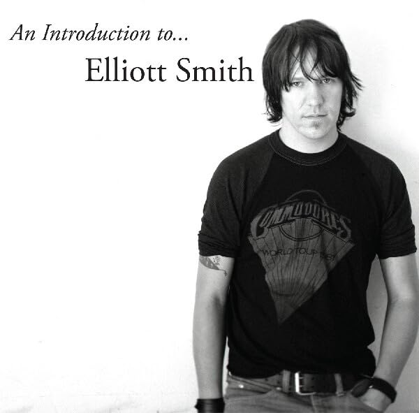 Black and white portrait of musician Elliott Smith, looking slightly downward.