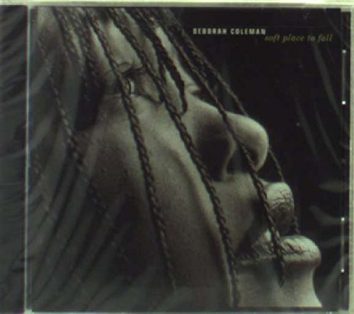 Close-up of a person with braided hair, monochrome album cover.
