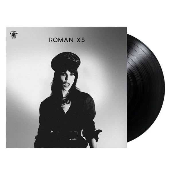 Black and white album cover featuring a woman in a hat, vinyl record.
