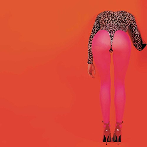 Person in pink tights and leopard print top, viewed from behind.