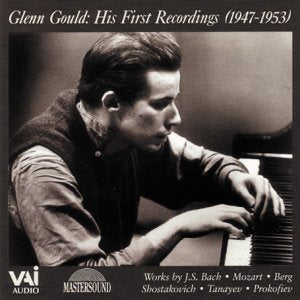 Black and white portrait of pianist Glenn Gould at a piano.