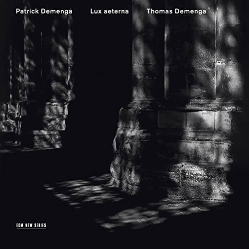 CD cover for "Lux Aeterna" featuring abstract stone architecture in shadow.