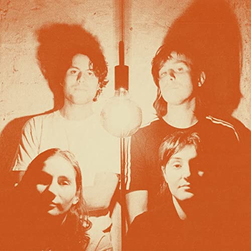 Four people with long hair in a monochromatic orange-toned portrait.