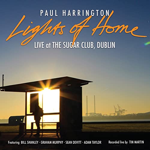 CD cover for Paul Harrington's "Lights Of Home" with a bus shelter scene.