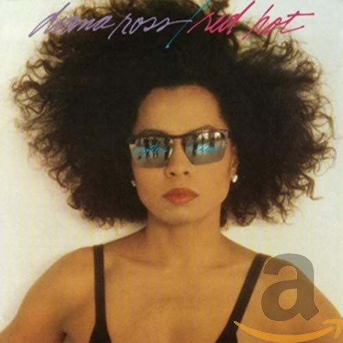 Diana Ross album cover, close-up portrait with large afro and sunglasses.