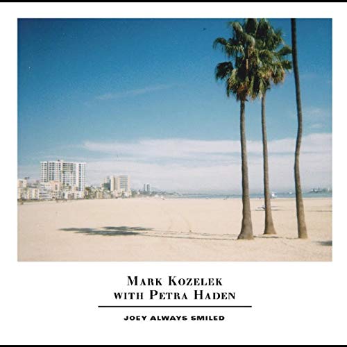 Album cover: beach, palm trees, city skyline, and text "Joey Always Smiled".