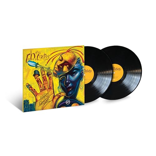 Vinyl record album cover and two black vinyl discs.