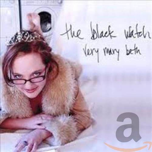 Woman with glasses and fur coat on album cover.