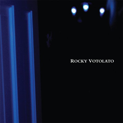 Dark album cover with blue streaks and the artist’s name.