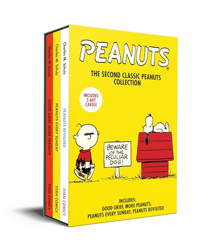 Yellow boxed set of three Peanuts comic books with Snoopy and Charlie Brown.