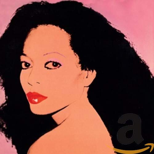 Close-up portrait of Diana Ross with curly black hair, pink background.