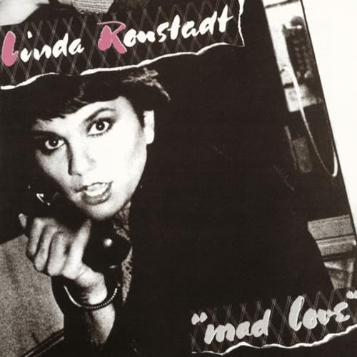 Linda Ronstadt’s “Mad Love” CD cover, black and white portrait with pink text.