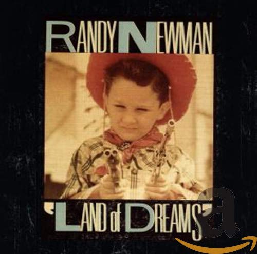 Randy Newman's "Land of Dreams" CD cover featuring a young boy in cowboy attire.