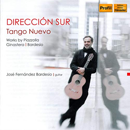 CD cover: Man with guitar, reflected in a building’s glass facade.