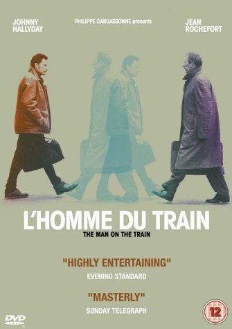 DVD cover for "L'homme Du Train" featuring three men walking.