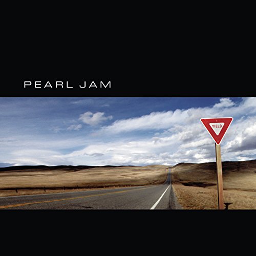 Pearl Jam’s “Yield” CD cover: yield sign in a rural landscape.