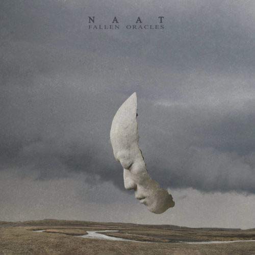 Album cover: broken stone face floats above a desolate landscape.