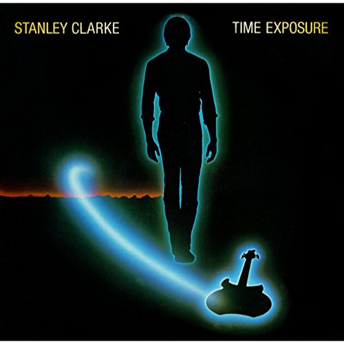 Silhouette of a man and a guitar with a glowing blue light trail.