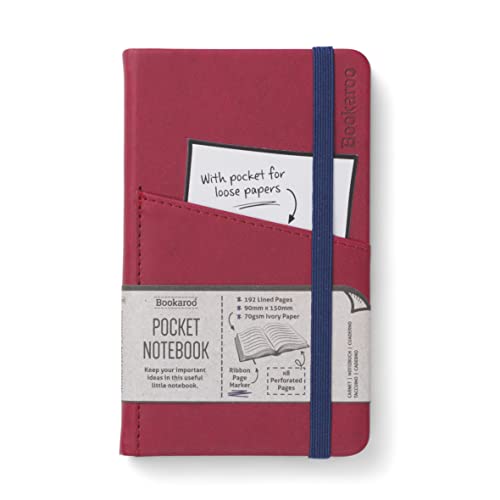 Dark red A6 notebook with a blue elastic band and inner pocket.