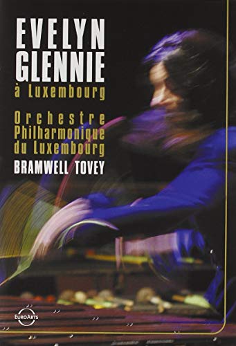 DVD cover featuring a conductor with orchestra in motion.