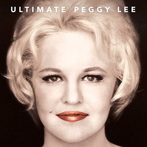 Close-up portrait of blonde singer Peggy Lee, looking directly at the viewer.