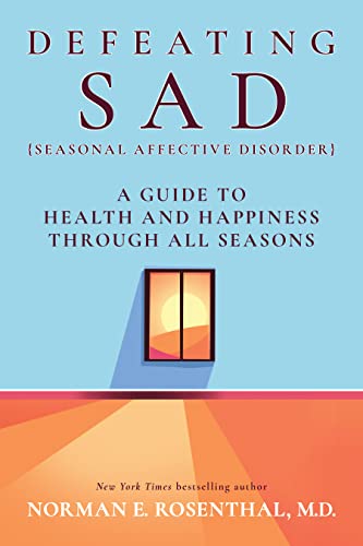 Book cover: "Defeating SAD" with a window showing a sunset.
