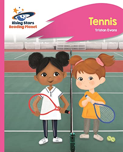 Two young girls holding tennis rackets stand on a tennis court.
