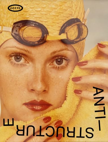 Close-up of a woman with swimming goggles and a yellow towel.