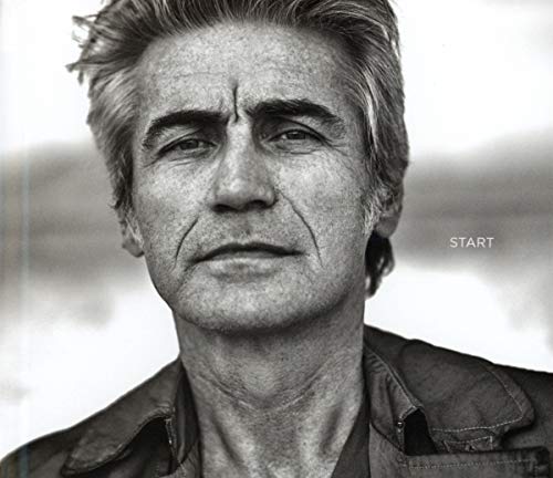 Black and white portrait of Ligabue with the word "START" visible.