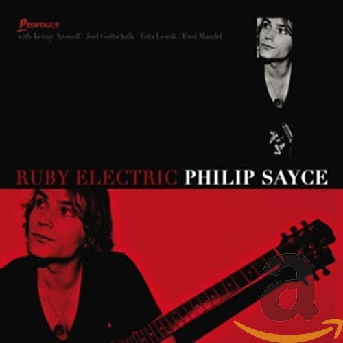 CD cover for Philip Sayce’s “Ruby Electric” featuring a portrait and guitar.