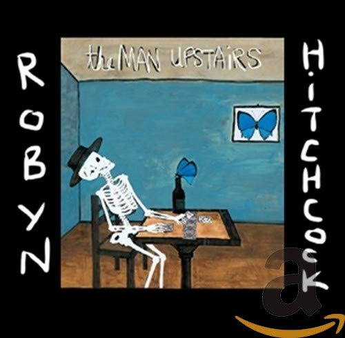 CD cover featuring a skeleton in a hat sitting at a table with wine.