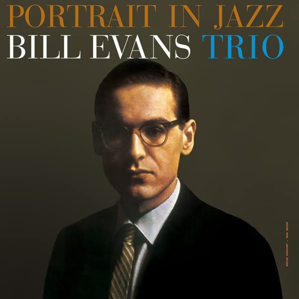 Album cover: Bill Evans in glasses, suit, against a green background.