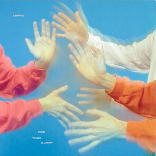 Multiple hands in motion against a blue background with blurred, overlapping movement effects.