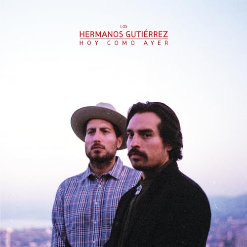 Album cover featuring two men in hats against a pale sky.