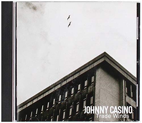 CD case for Johnny Casino’s “Trade Winds” album, building and birds.