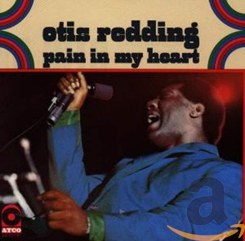 Otis Redding singing into a microphone, album cover for "Pain in My Heart.