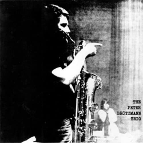 Black and white photo of a saxophonist playing, album cover.
