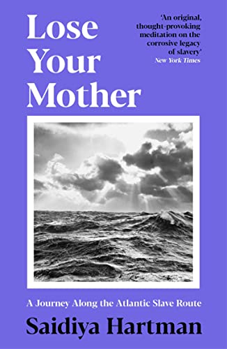 Book cover with purple background, white text, and a black-and-white photo of the ocean.