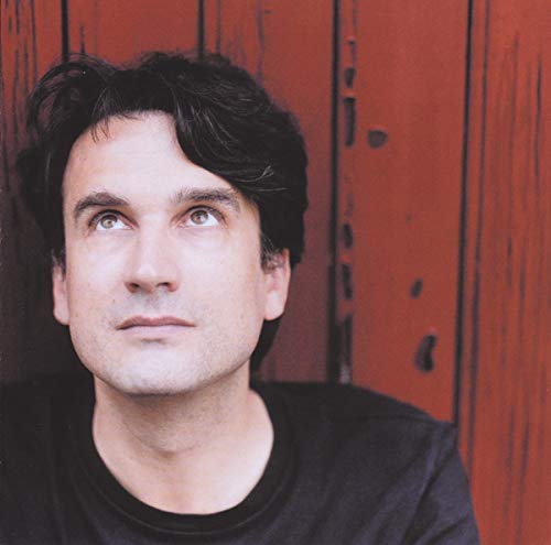 Portrait of Baptiste Trotignon, a man looking upwards with dark hair.