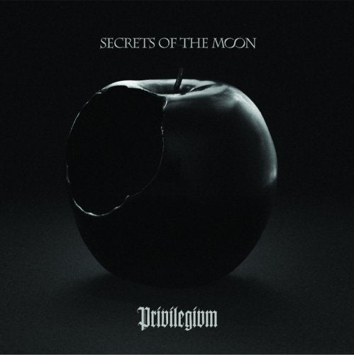 Dark album cover featuring a bitten, glossy black apple with text.