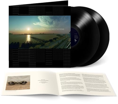 Lou Reed double vinyl record, open booklet, and a photograph of a bike chain.