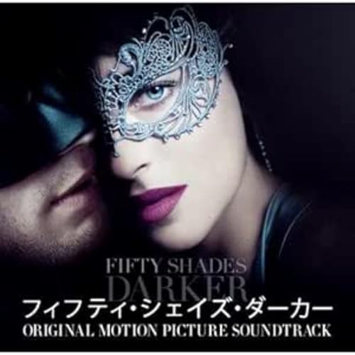 Woman in mask, close-up, with film title "Fifty Shades Darker" below.